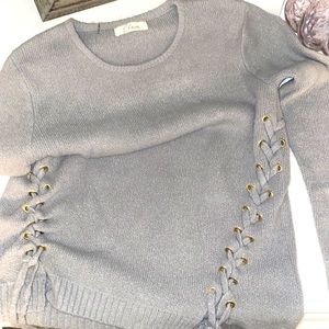 Grey sweater with ties . Great detail and condition